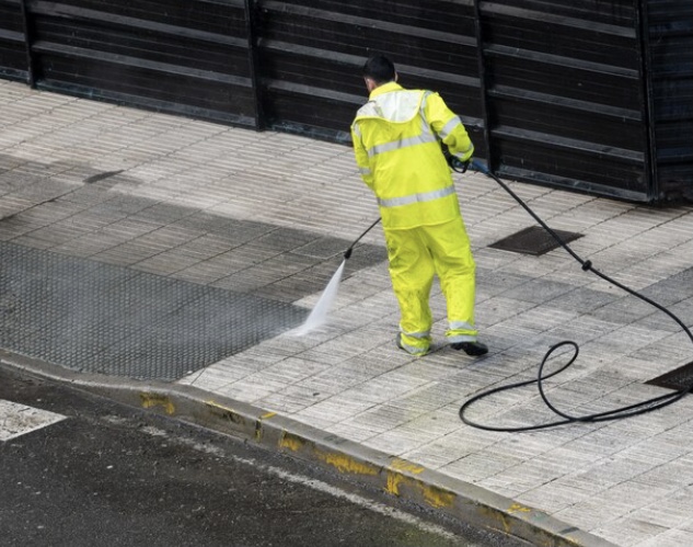 Pressure washing a commercial sidewalk and hard surface