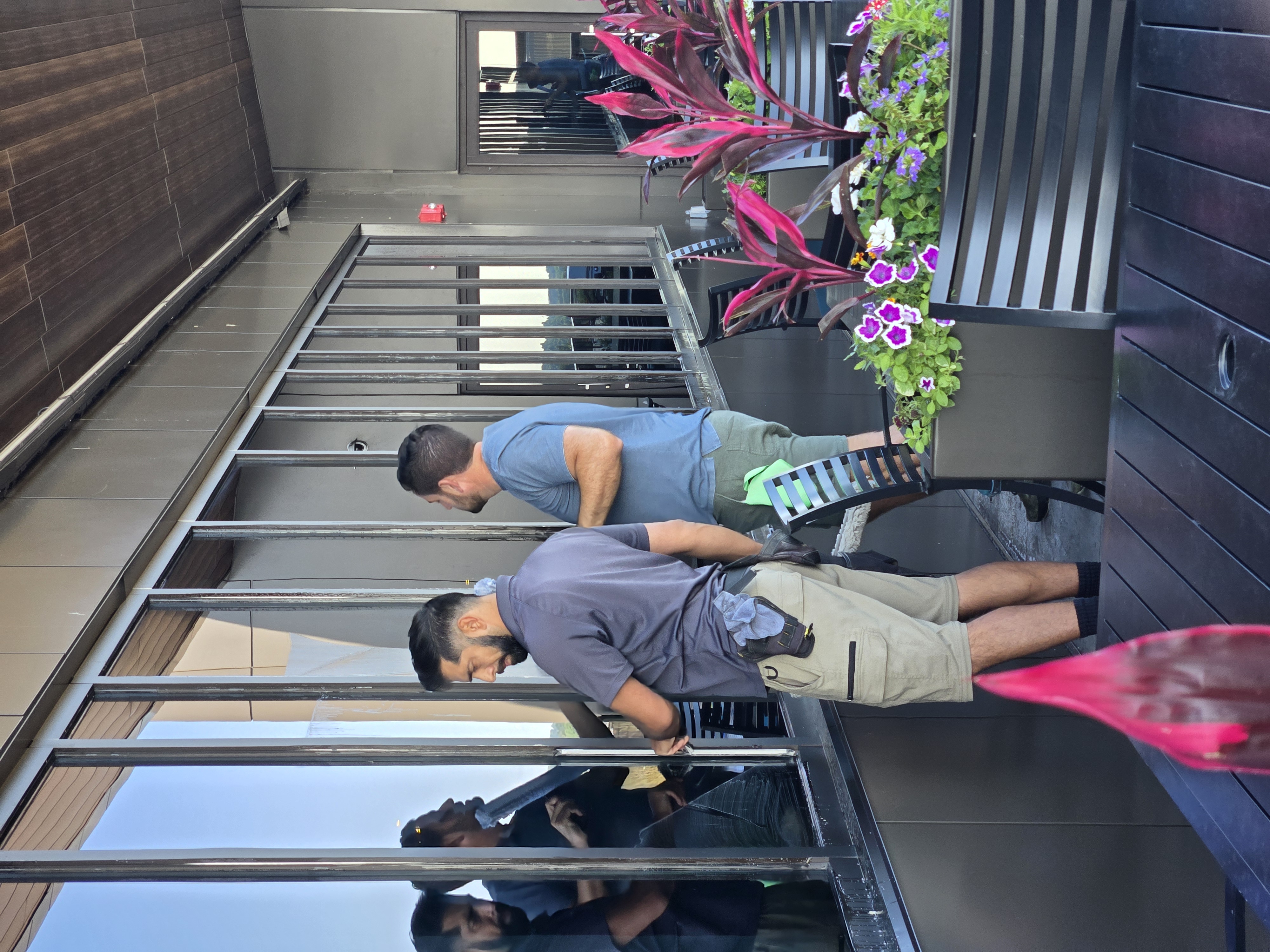 Interior commercial window cleaning in an occupied hospitality area